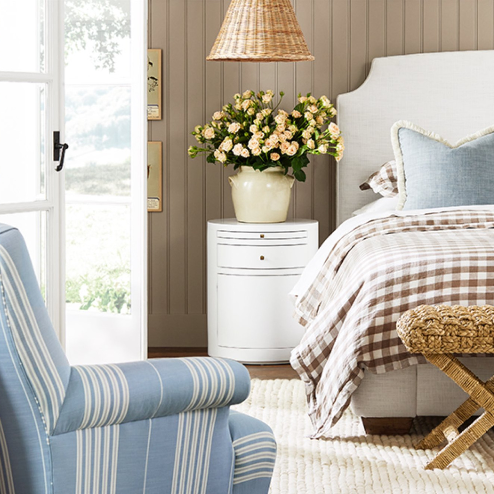 Coastal bedroom with neutrals, beadboard, gingham, stripe chair, chambray blue accents and French confit jar with roses - Serena & Lily. #coastalbedroom #neutralbedroom #sophisticatedbedroom