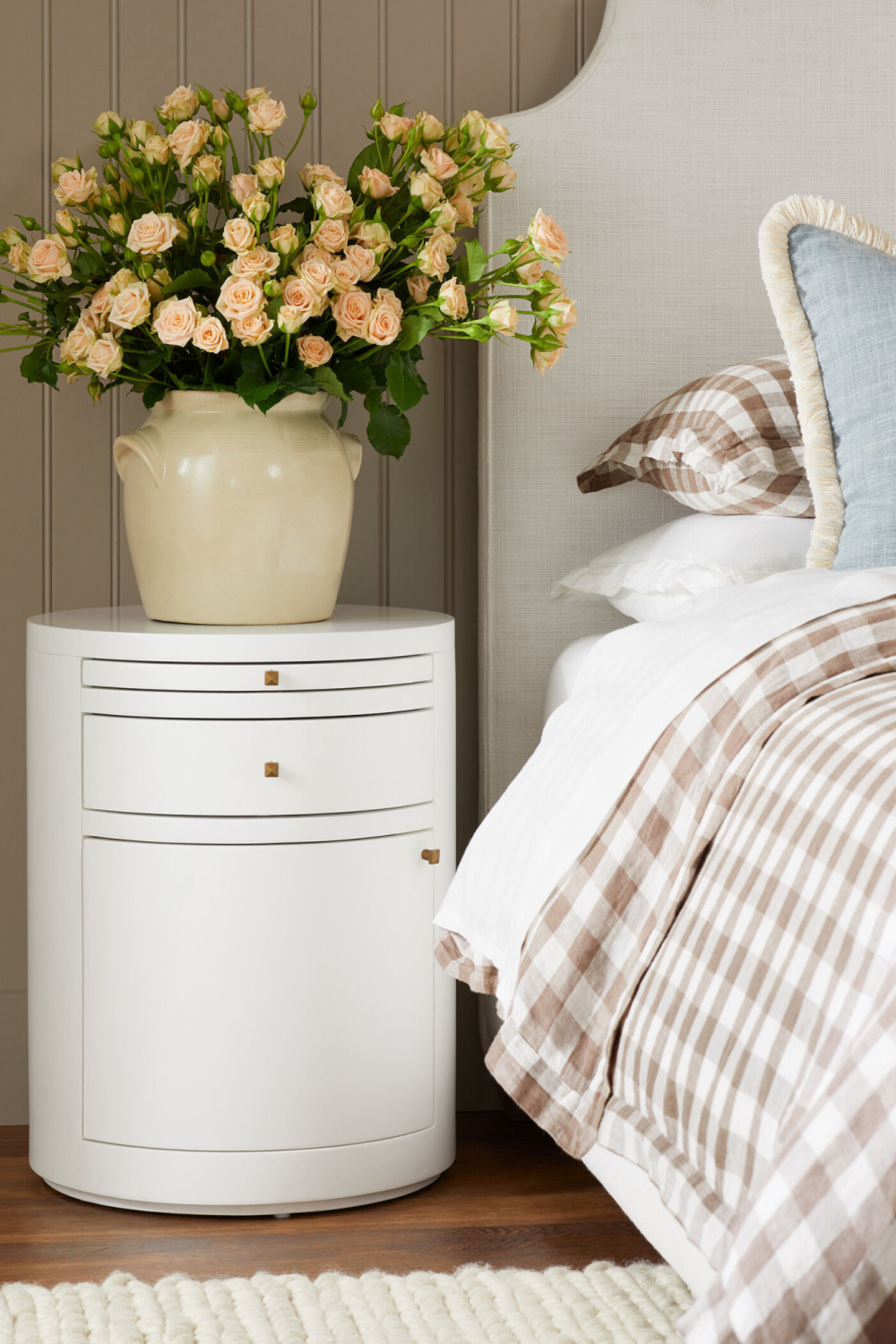 Sophisticated and neutral coastal bedroom with gingham bedding, French confit jar with roses on nightstand - Serena & Lily. #coastalbedroom #gingham #neutralbedroom