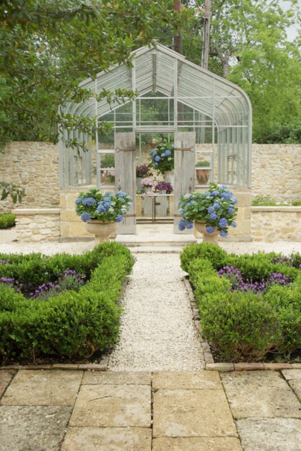 Exquisite French garden with conservatory and reclaimed stone from France - Chateau Domingue. #frenchgardens #conservatory