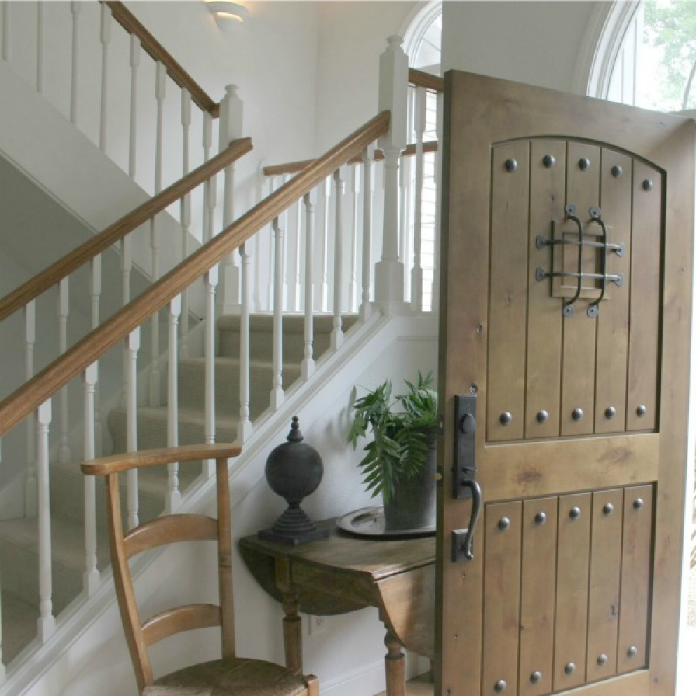 In our two story entry, a rustic alder planked front door with speakeasy makes a handsome statement - Hello Lovely.