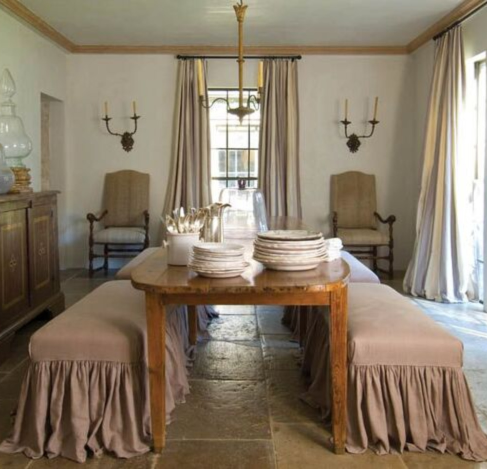 Ruth Gay's gorgeous rosy dining room with Old World French elegance. Chateau Domingue Timeless European Elegance and French farmhouse style converge in this house tour of founder Ruth Gay's home on Hello Lovely. Reclaimed stone, antique doors and mantels, and one of a kind architectural elements. #housetour #frenchcountry #frenchfarmhouse #europeanfarmhouse #chateaudomingue #rusticdecor #pamelapierce #elegantdecor #diningroom #romantic