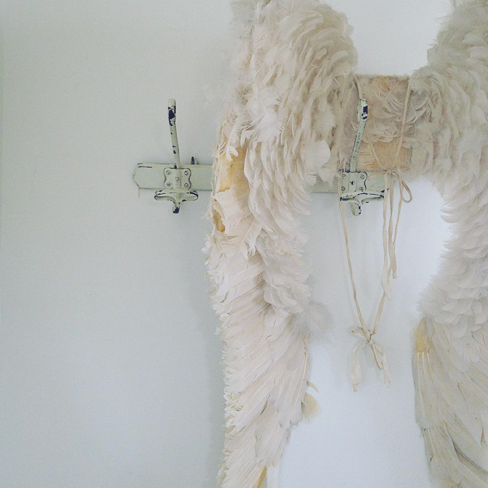 Antique angel wings in an all white Scandi cottage with French antiques and vintage - My Petite Maison.