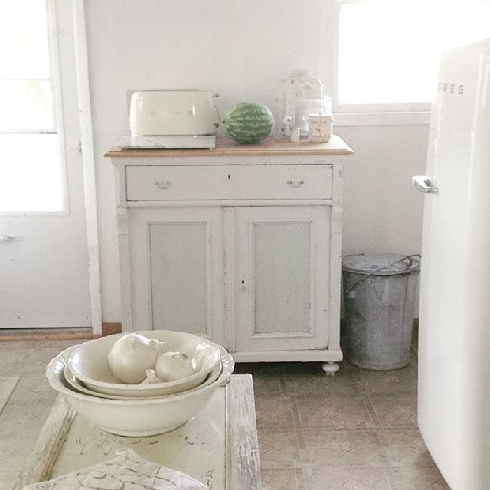 Ethereal and serene all white cottage kitchen with Smeg refrigerator and Swedish antiques - My Petite Maison.