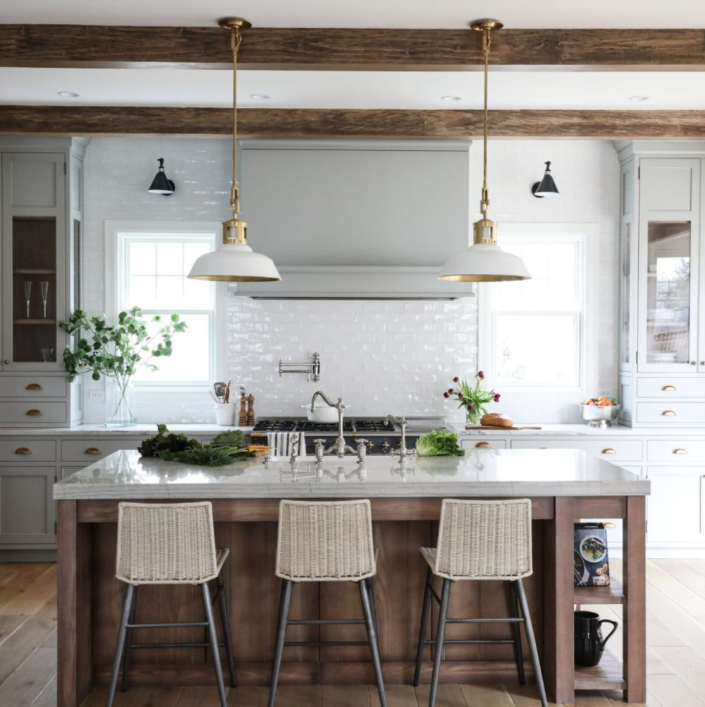 Lamp Room Gray (Farrow & Ball) paint color on cabinets in a beautiful custom kitchen with wood beams and subway tile - Park & Oak. #graykitchens #lamproomgray #paintcolors