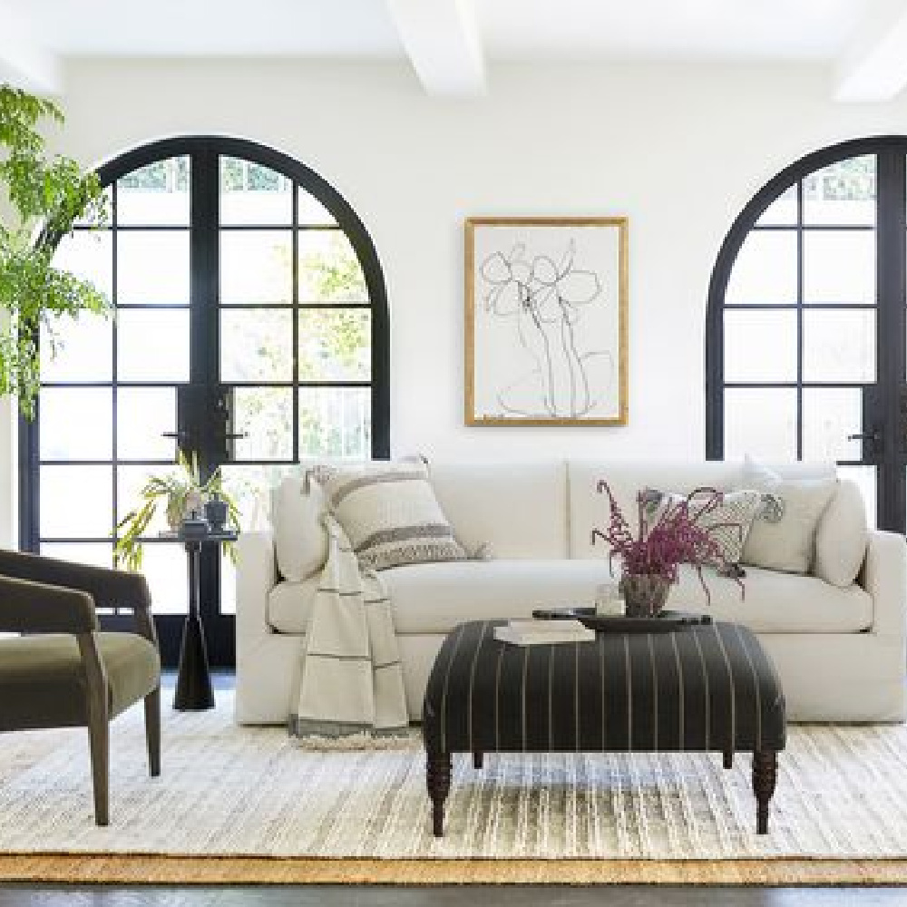 Black and white classic living room with Myla slipcovered sofa from Lulu & Georgia. #slipcoveredsofa #livingroomfurniture #whitesofas