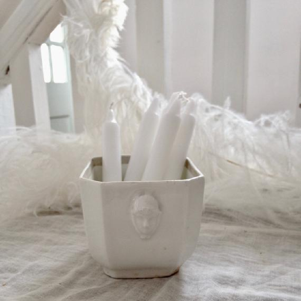 French antique faience sugar bowl holding white candles in a Nordic French cottage by @mypetitemaison.