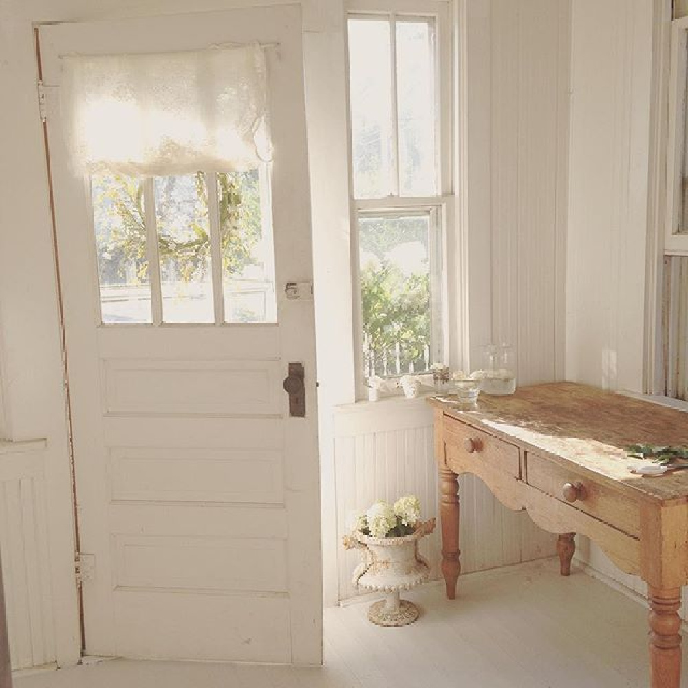 All white Nordic French cottage entry with ethereal mood and Swedish and French antiques - @mypetitemaison.