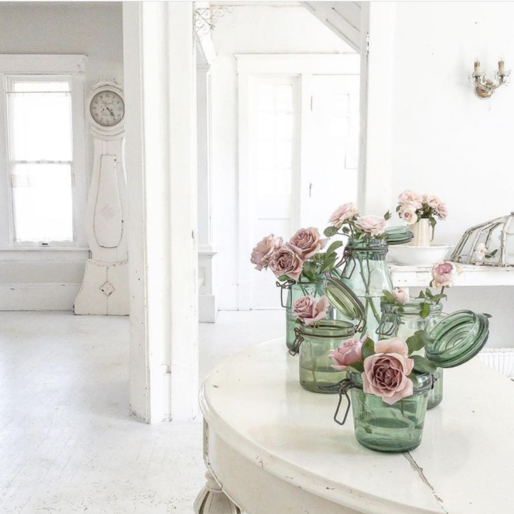 Lovely pink garden roses in green vintage jars within a white Nordic French home with antique Swedish mora clock - @mypetitemaison.