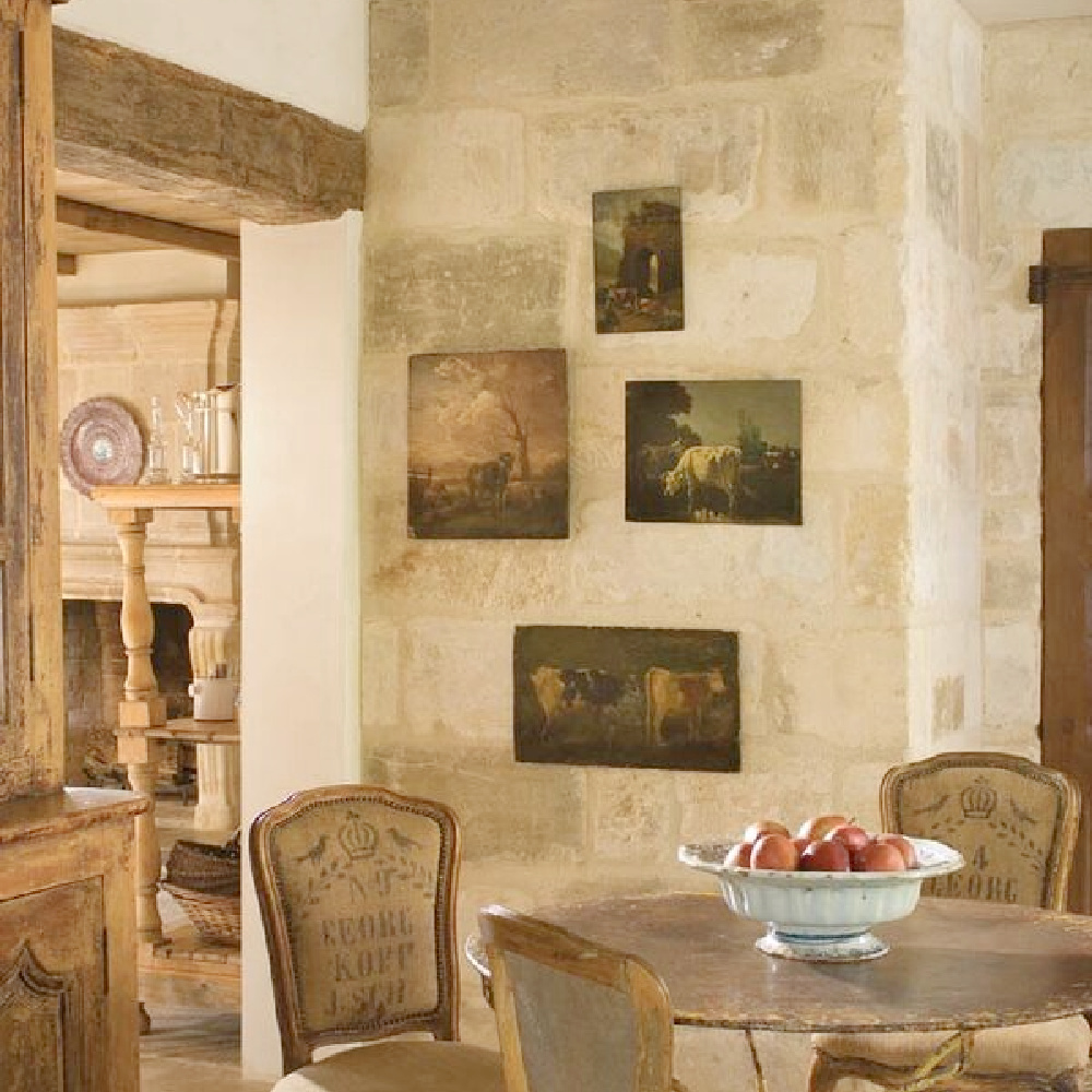 French kitchen with Old World style, stone walls, antique paintings, and charm from Chateau Domingue.