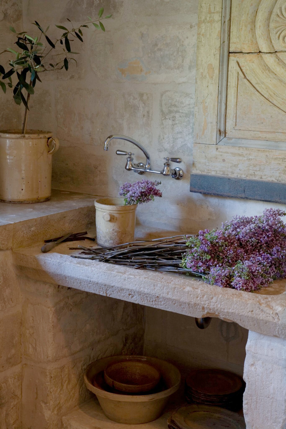 Country French romance and authenticity - rugged stone and French earthenware in Ruth Gay's stunning country French house in Houston - Chateau Domingue.