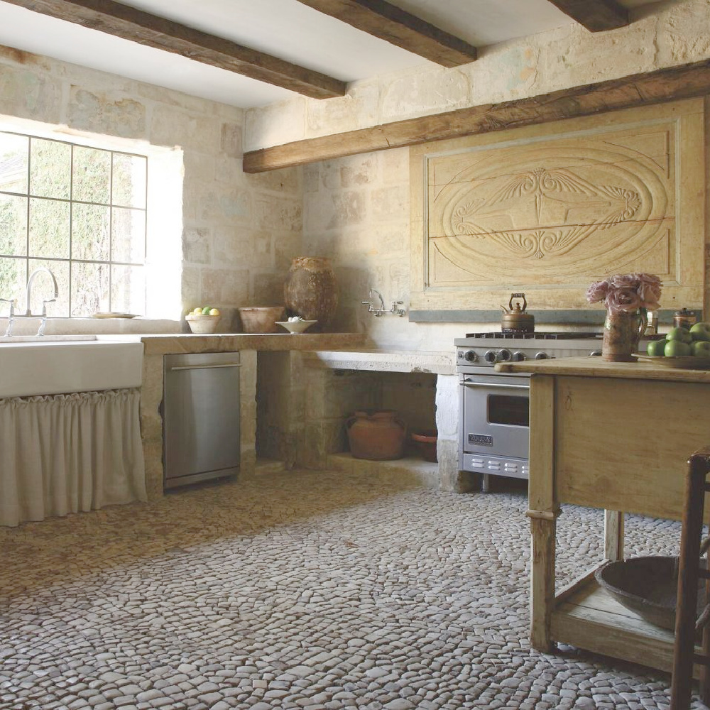 Authentic antique reclaimed materials from Europe in a newly built kitchen with Old World charm - Chateau Domingue. #frenchkitchen #frenchantiques #frenchlimestone #frenchcountry