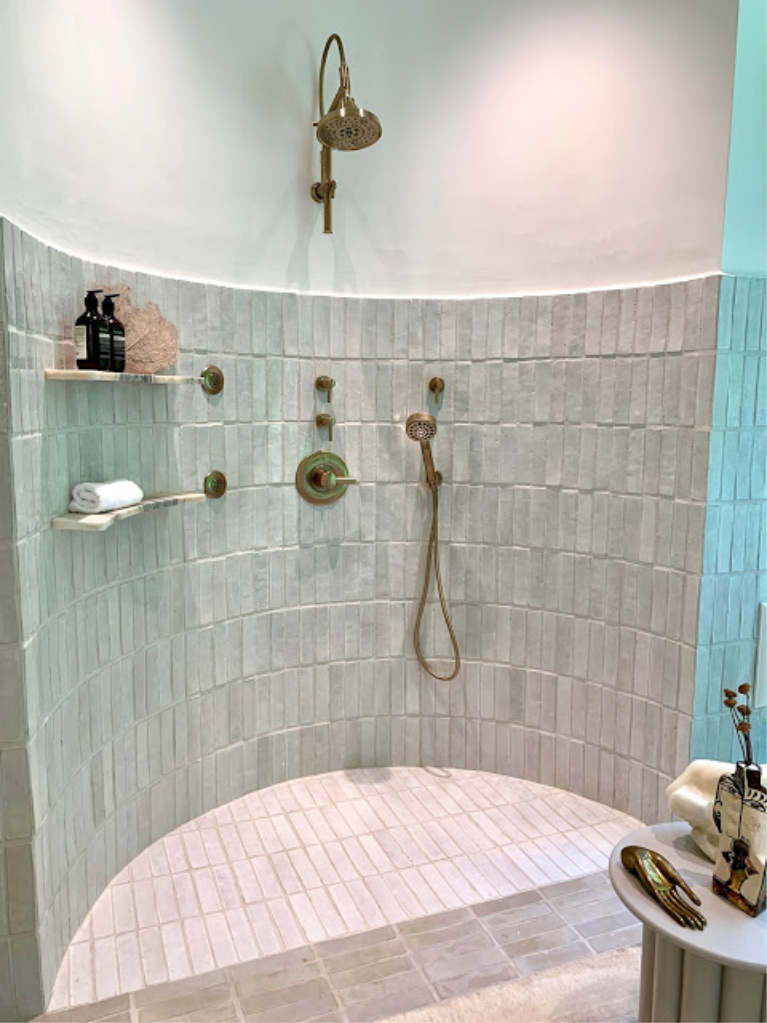 Curved tiled shower in the 2020 Southeastern Designer Showhouse. #showers #bathroomdesign #tiledshowers #luxurybath