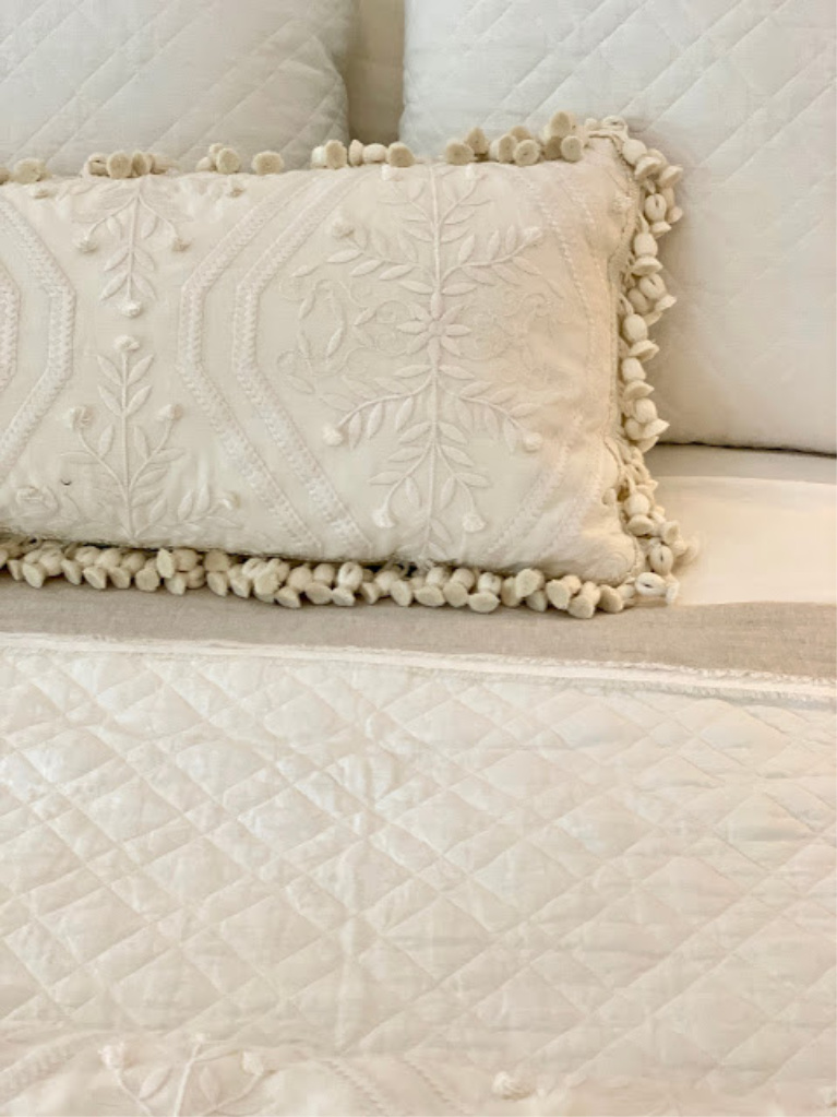 Sumptuous creamy bedding chosen by Phoebe Howard for the 2020 Southeastern Designer Showhouse. #bedroomdecor #bedding #phoebehoward #whitebedrooms #interiordesign