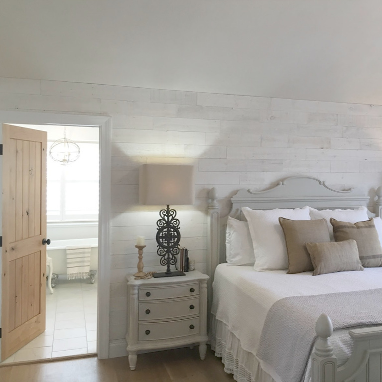 French country Nordic bedroom with Stikwood Hamptons wallcovering and bathroom with clawfoot tub. #hellolovelystudio #mastersuite #frenchcountry #frenchnordic #stikwood #hamptons #cottagestyle #bedroomdecor #clawfoottub