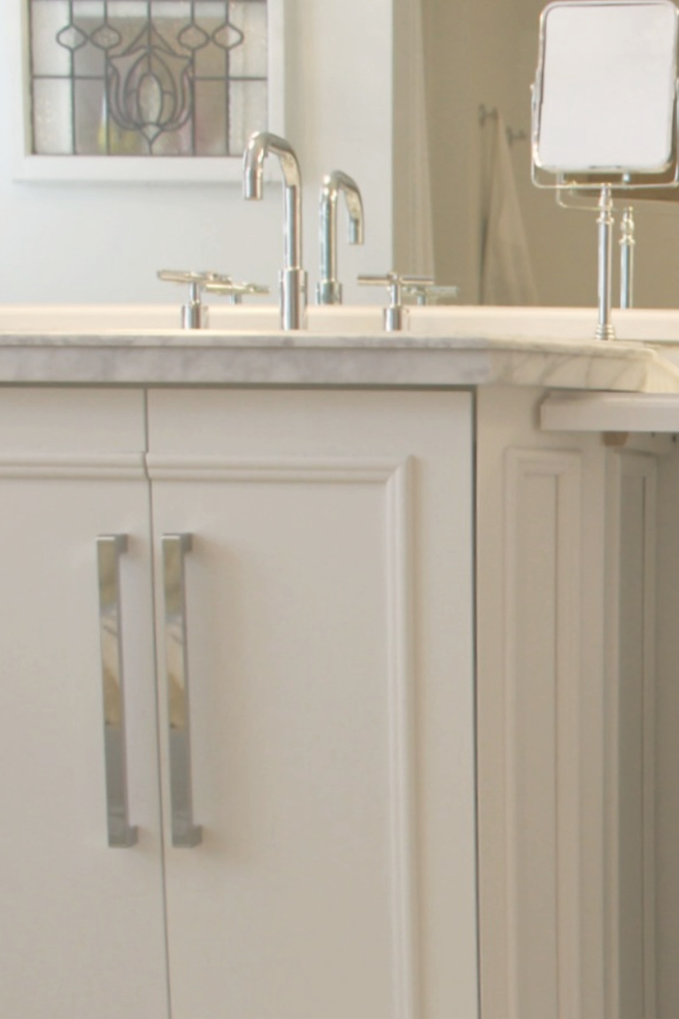 Traditional freestanding white single vanity with carrara marble top in our French country bathroom. #hellolovelystudio #bathroomdesign #whitevanity #carraramarble #kohlerpurist #bathroomfaucets