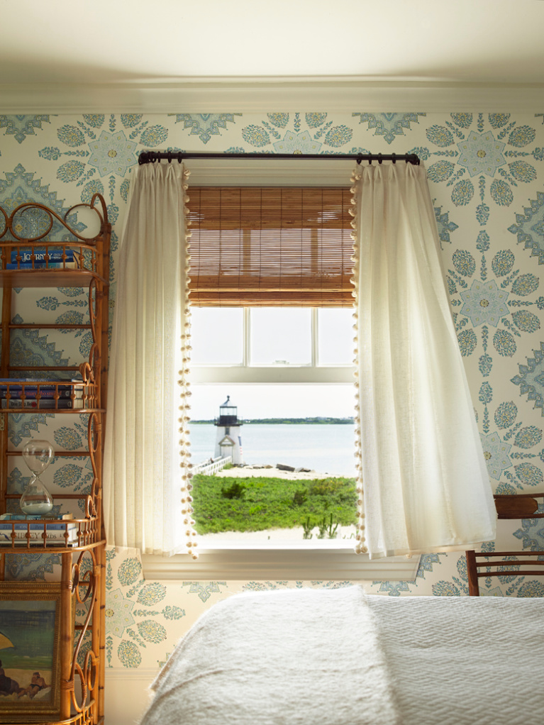 Tom Scheerer designed coastal wallpapered blue and white bedroom in a Nantucket seaside home. Photo by Tria Giovan for Jennifer Ash Rudick's Summer to Summer. #coastalstyle #bedroomdecor #coastalbedroom #interiordesign #blueandwhite #wallpaper #lighthouse 