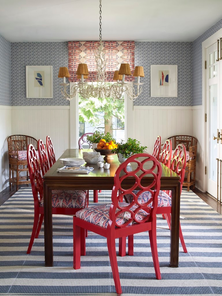 Meg Braff Designs' Swirls wallpaper in navy, combined with roman shades and seat cushions in China Seas' Malay Stripe in a breakfast room. Chairs are Francis Elkins Loop chairs in a Chinese vintage red. #interiordesign #traditionalstyle #megbraff #diningrooms #redwhiteblue #colorfulrooms