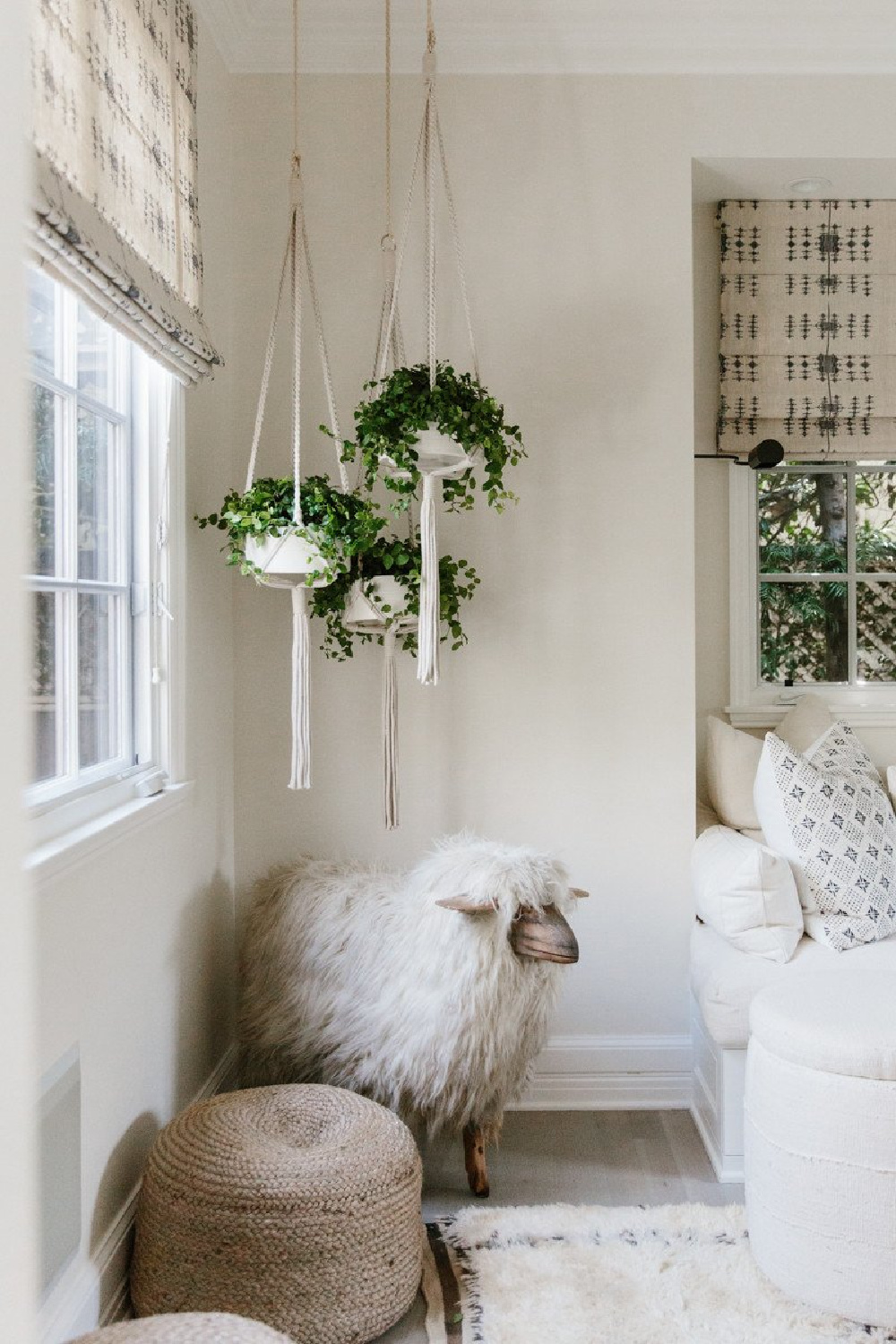 California modern farmhouse decor with hanging plants in Erin Fetherston home. Come explore more California modern farmhouse design inspiration!