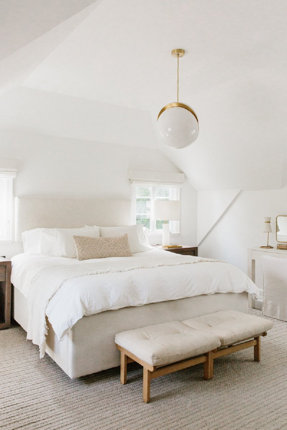 Erin Fetherston's serene white bedroom with linen and modern lighting. Come explore California modern farmhouse interior design inspiration! #bedroomdecor #whitebedrooms #interiordesign #modernfarmhouse #zen #serenedecor