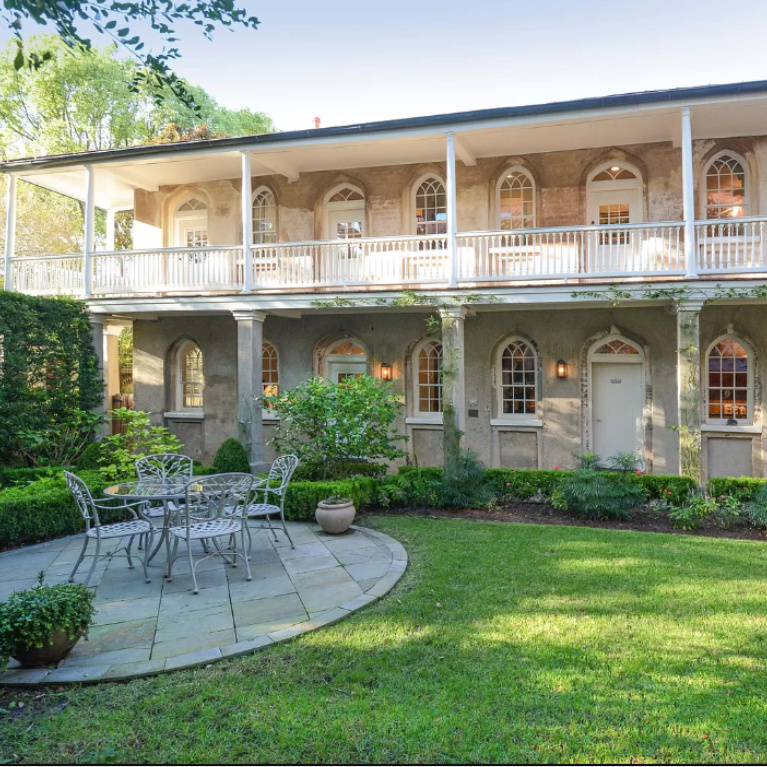 Back exterior of a gorgeous historic Charleston home with piazzas. #piazzas #charleston #historichomes #houseexteriors #housedesign #southernhomes