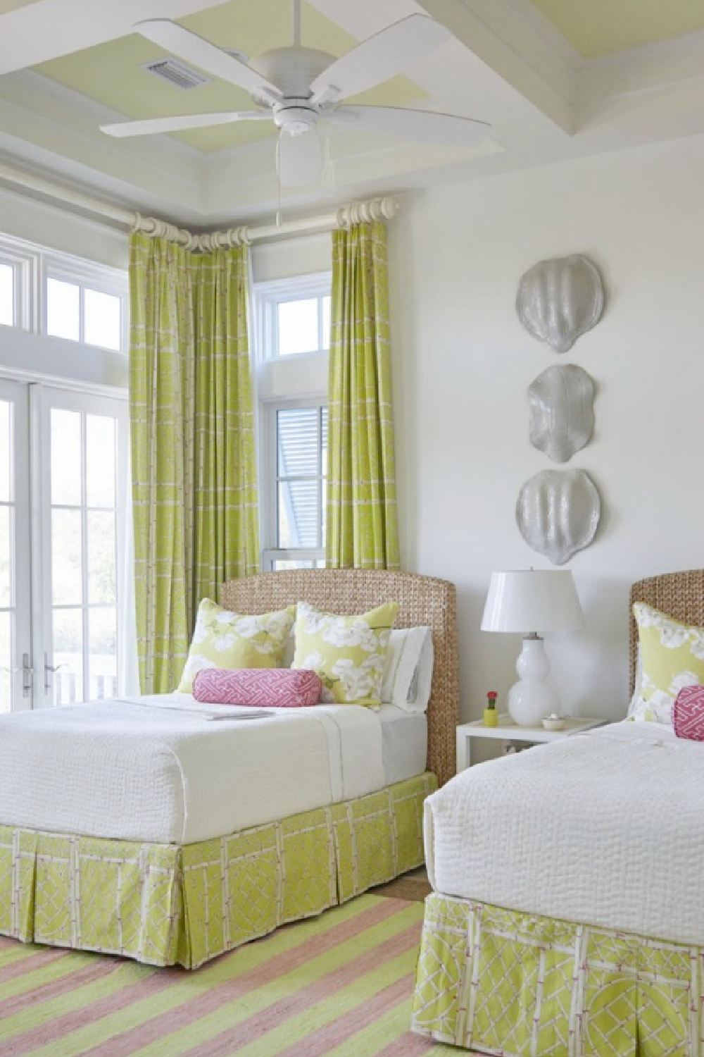 Chartreuse accents in a luxurious coastal bedroom with architecture by Geoff Chick.