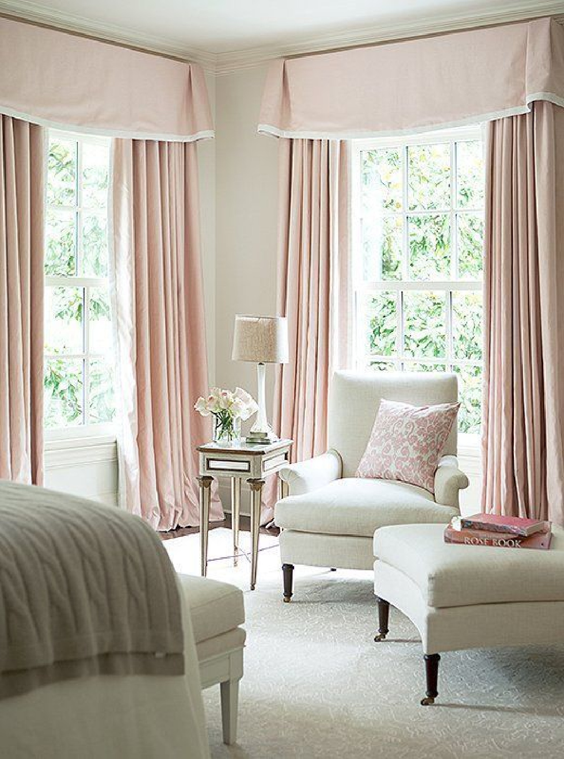 Intimate White (Sherwin Williams) pale pink paint color in Suzanne Kasler designed bedroom with pink curtains. #intimatewhite