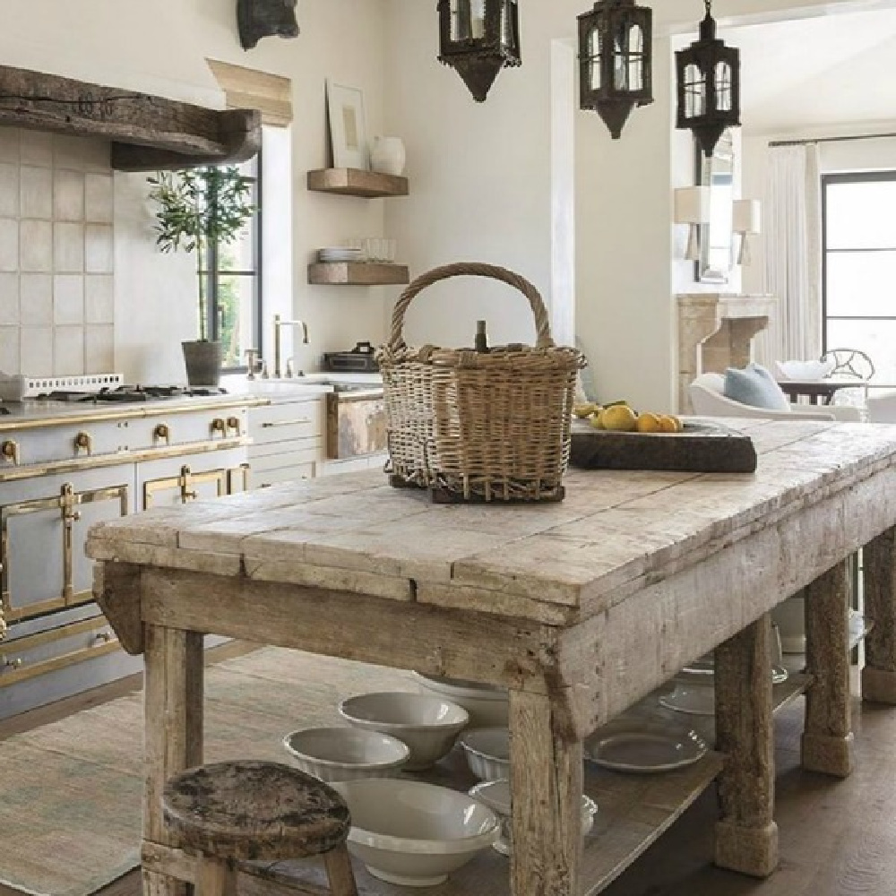 Magnificent rustic French kitchen with antique work table in Milieu magazine. Design by Cathy Chapman. Photo by Peter Vitale, Architect Home Front Build. #frenchkitchen #rustickitchen #oldworldstyle
