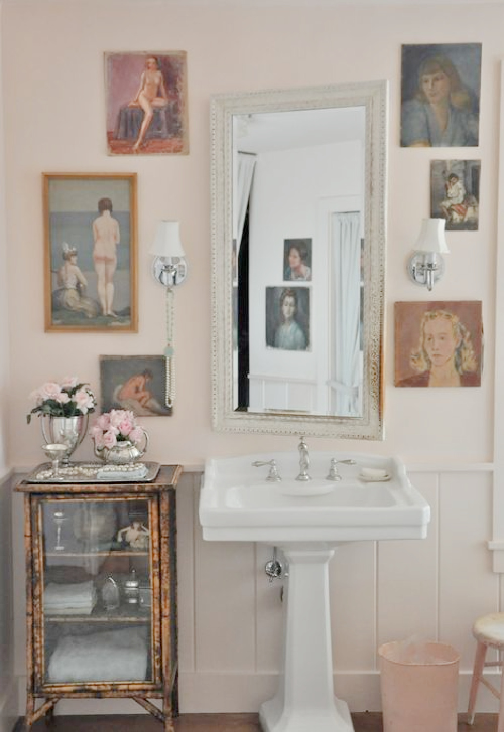Velvet and Linen's pink bathroom with Farrow & Ball Pink Ground paint color, vintage portrait gallery and pedestal sink. Come see the Best Sophisticated, Chic and Subtle Pink Paint Colors on Hello Lovely Studio!