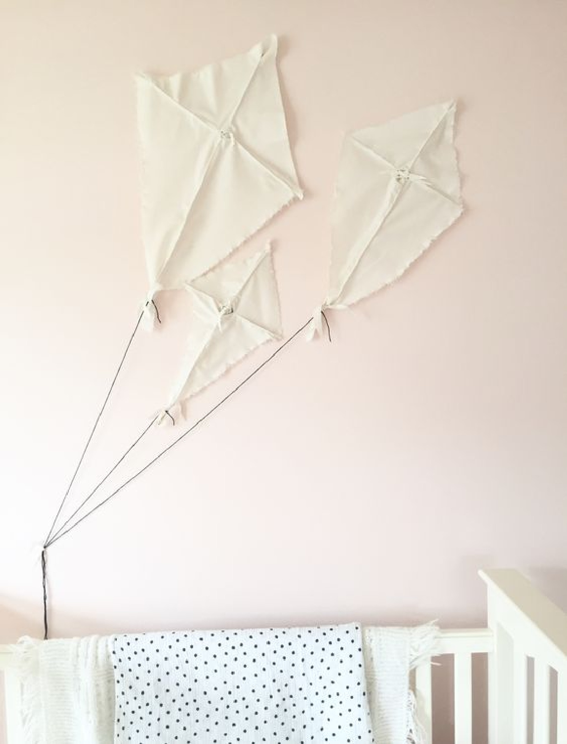 Baby girl nursery kites inspired by hgtv's Fixer Upper. Paint: Sherwin Williams Pink Dogwood. #pinkdogwood #paintcolors