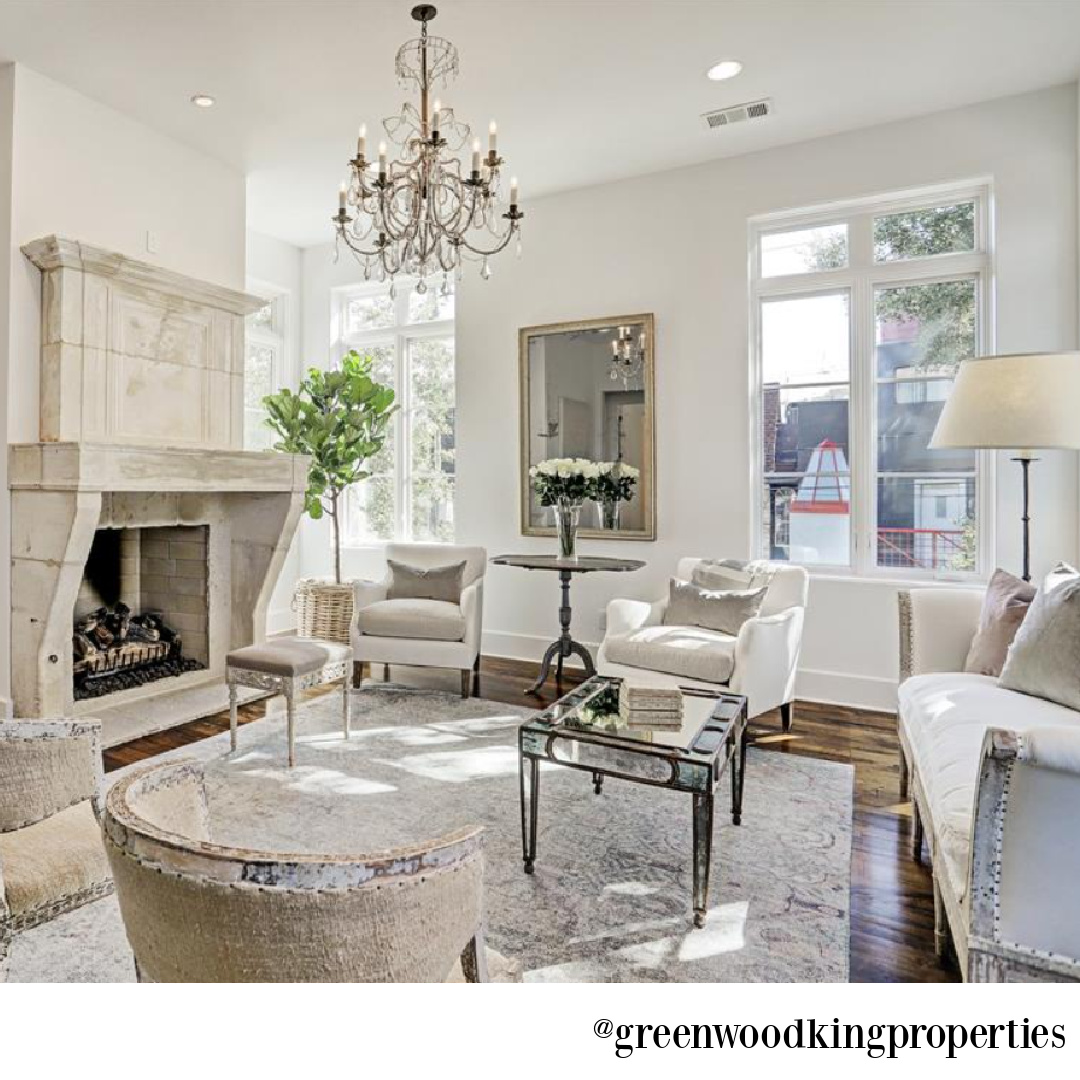 Sophisticated modern French white living room in a Houston home on Berthea with design by M Naeve - @greenwoodkingproperties