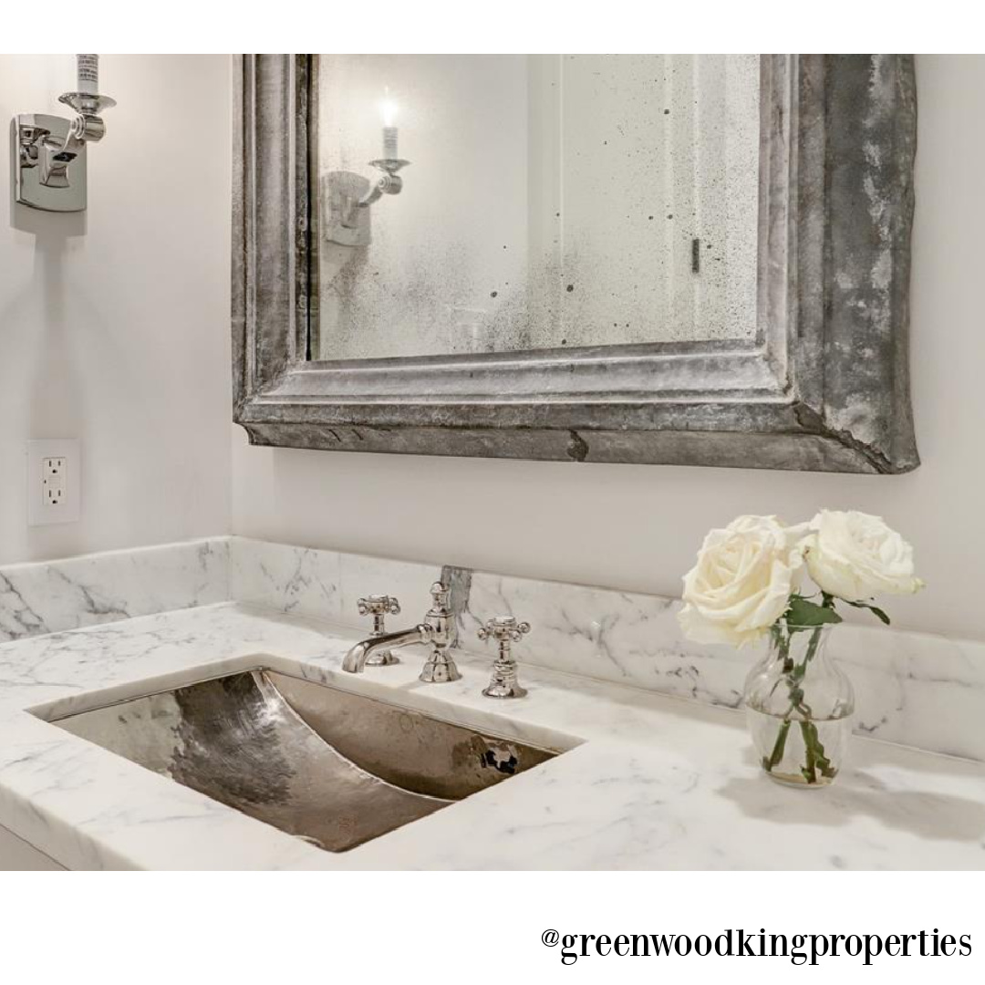 Carrera marble vanity, silver sink, and beautiful finishes in a modern French bath in Houston - M Naeve.