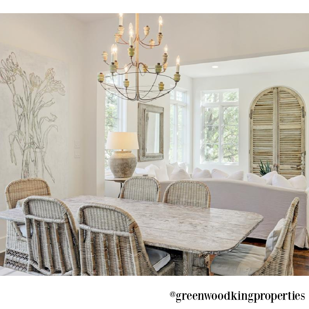 Modern French elegant white kitchen and dining area in a Houston home (115 Berthea) with interiors by M Naeve. #modernFrench #whitekitchens #frenchcountry