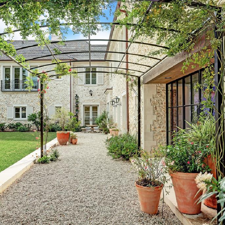 Breathtaking garden in French inspired Houston Home (2535 Inwood). #frenchcountry #housedesign #interiordesign #luxuryhome #frenchhome #sophisticateddecor