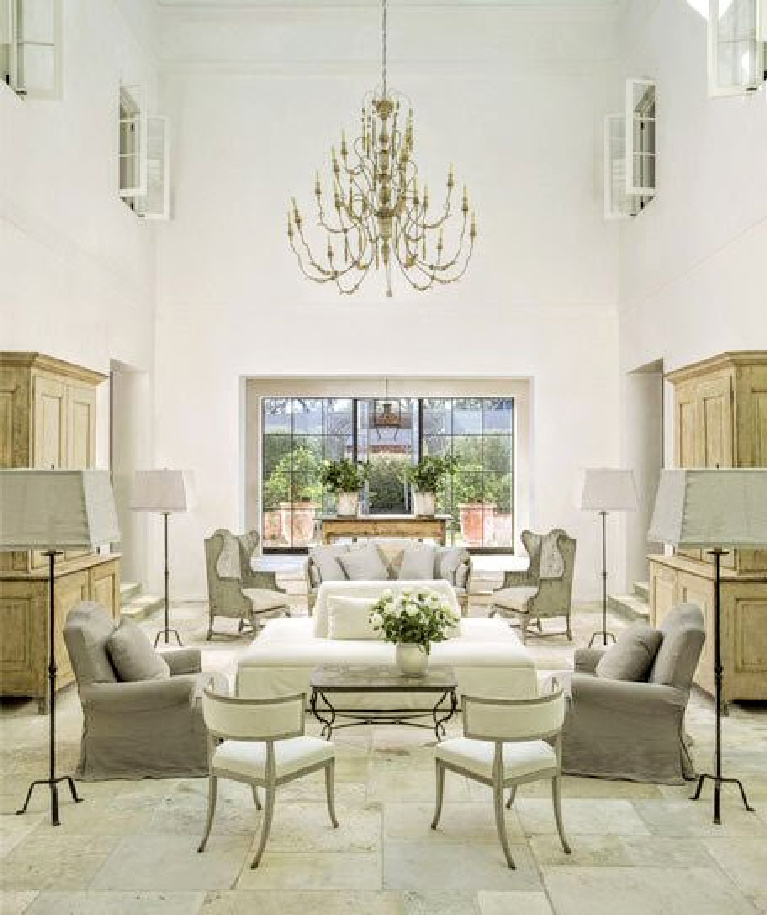 Pamela Pierce designed French country living room with soaring ceiling and stone floors. #pamelapierce #livingroom #interiordesign #frenchcountry