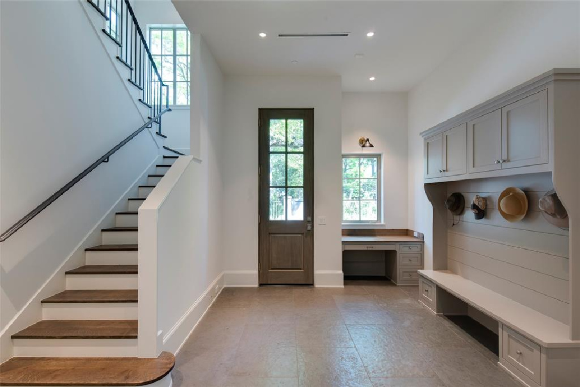 Mud room with builtin bench in Stunning French inspired luxury home in Houston. #luxuryhome #frenchhome #frenchcountry #sophisticateddecor #timelessdesign