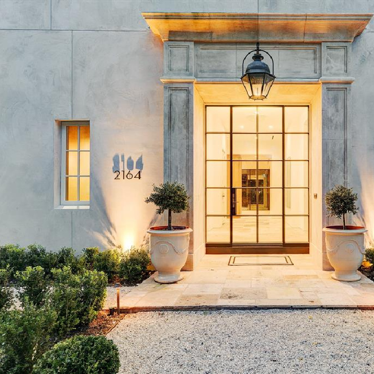 Stunning European elegance and curb appeal for this Houston home built by Morris Hullinger. #frenchcountry #houseexterior #dreamhome #stuccohome #europeancountry #houseexteriors