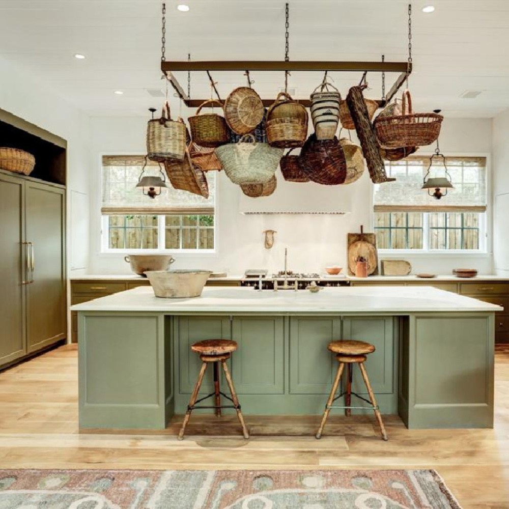 Luxurious Old World green kitchen with large island and pot rack - designed by Shannon Bowers for Milieu Showhouse 2020. #oldworldstyle #shannonbowers #europeancountry #kitchendesign #potrack