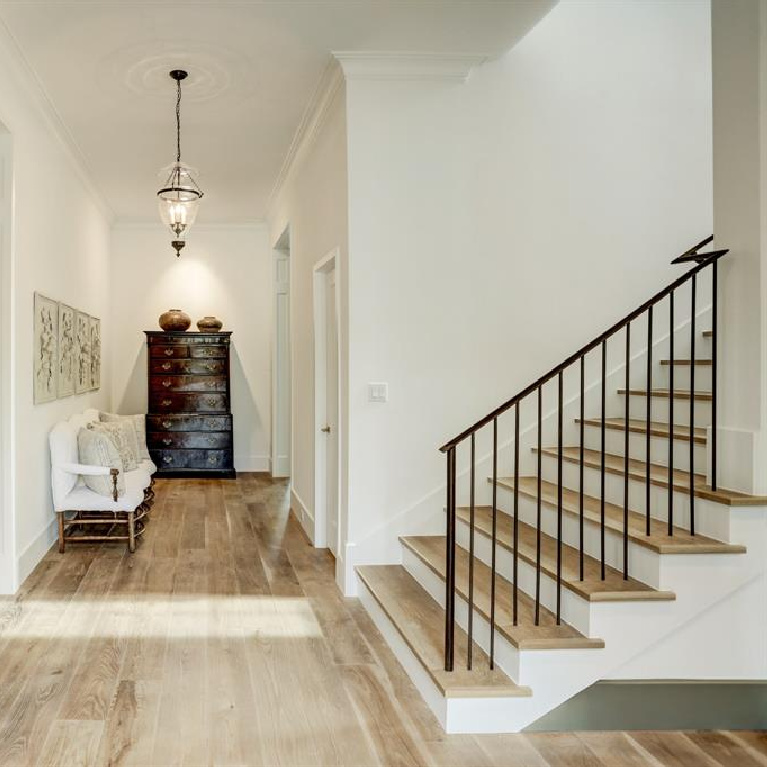 White oak flooring in hall and staircase in MILIEU Showhouse 2020 - featuring exceptional designers including Darryl Carter, Kathryn Ireland, Pamela Pierce, Shannon Bowers, and more. #milieushowhouse #interiordesign #designershowhouse #luxuryhome #edwinlutyens #houstonhome