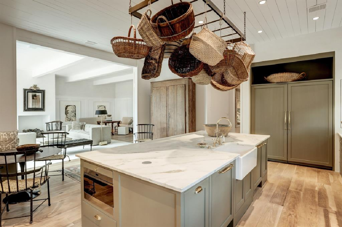 French baskets above kitchen island in MILIEU Showhouse 2020 - featuring exceptional designers including Darryl Carter, Kathryn Ireland, Pamela Pierce, Shannon Bowers, and more. #milieushowhouse #interiordesign #designershowhouse #luxuryhome #edwinlutyens #houstonhome #kitchendesign #shannonbowers