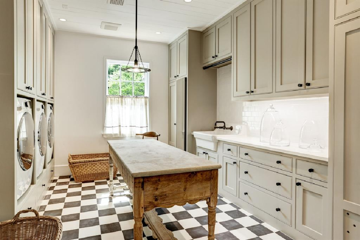 Laundry room with checker flooring in MILIEU Showhouse 2020 - featuring exceptional designers including Darryl Carter, Kathryn Ireland, Pamela Pierce, Shannon Bowers, and more. #milieushowhouse #interiordesign #designershowhouse #luxuryhome #edwinlutyens #houstonhome #laundryrooms