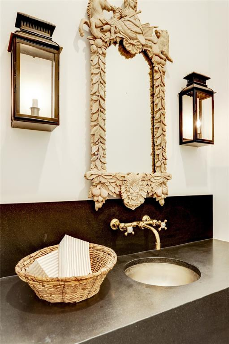 Powder room with lantern sconces in MILIEU Showhouse 2020 - featuring exceptional designers including Darryl Carter, Kathryn Ireland, Pamela Pierce, Shannon Bowers, and more. #milieushowhouse #interiordesign #designershowhouse #luxuryhome #edwinlutyens #houstonhome #bathroom