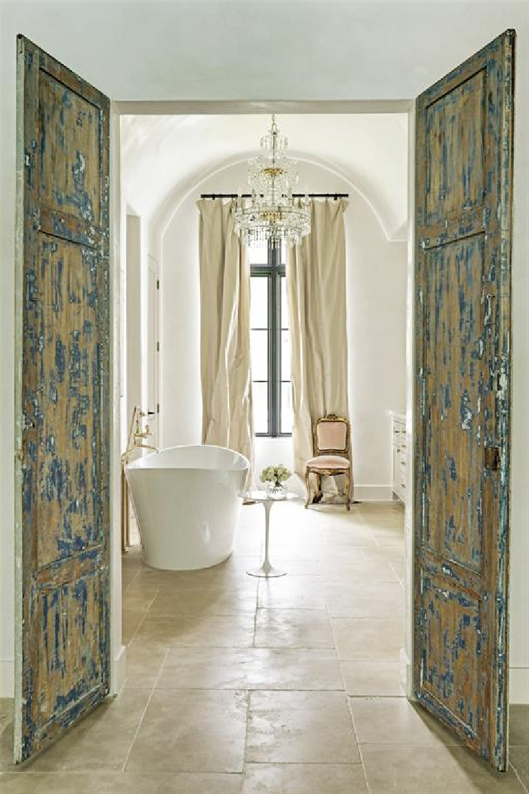 Luxurious French bathroom with soaking tub and sparkling chandelier. #bathroomdesign #frenchcountry #elegantdecor #luxuryhome #interiordesign