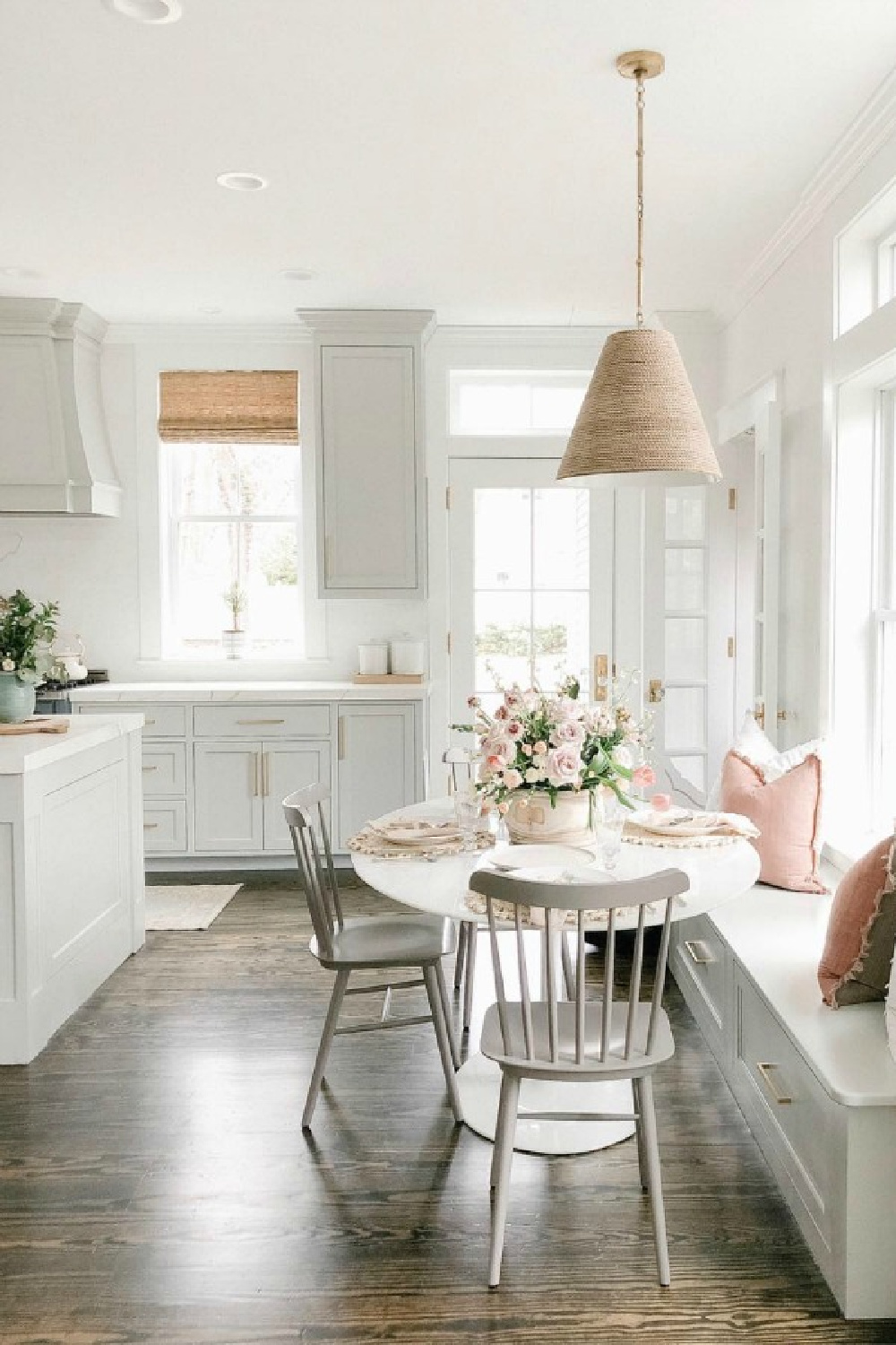 Elegant white farmhouse kitchen with Benjamin Moore Repose Grey cabinets, subway tile, gold accents, and reclaimed barn wood. Design: Finding Lovely.  See more Gorgeous European Country Interior Design Inspiration on Hello Lovely. #europeancountry #frenchfarmhouse #interiordesign