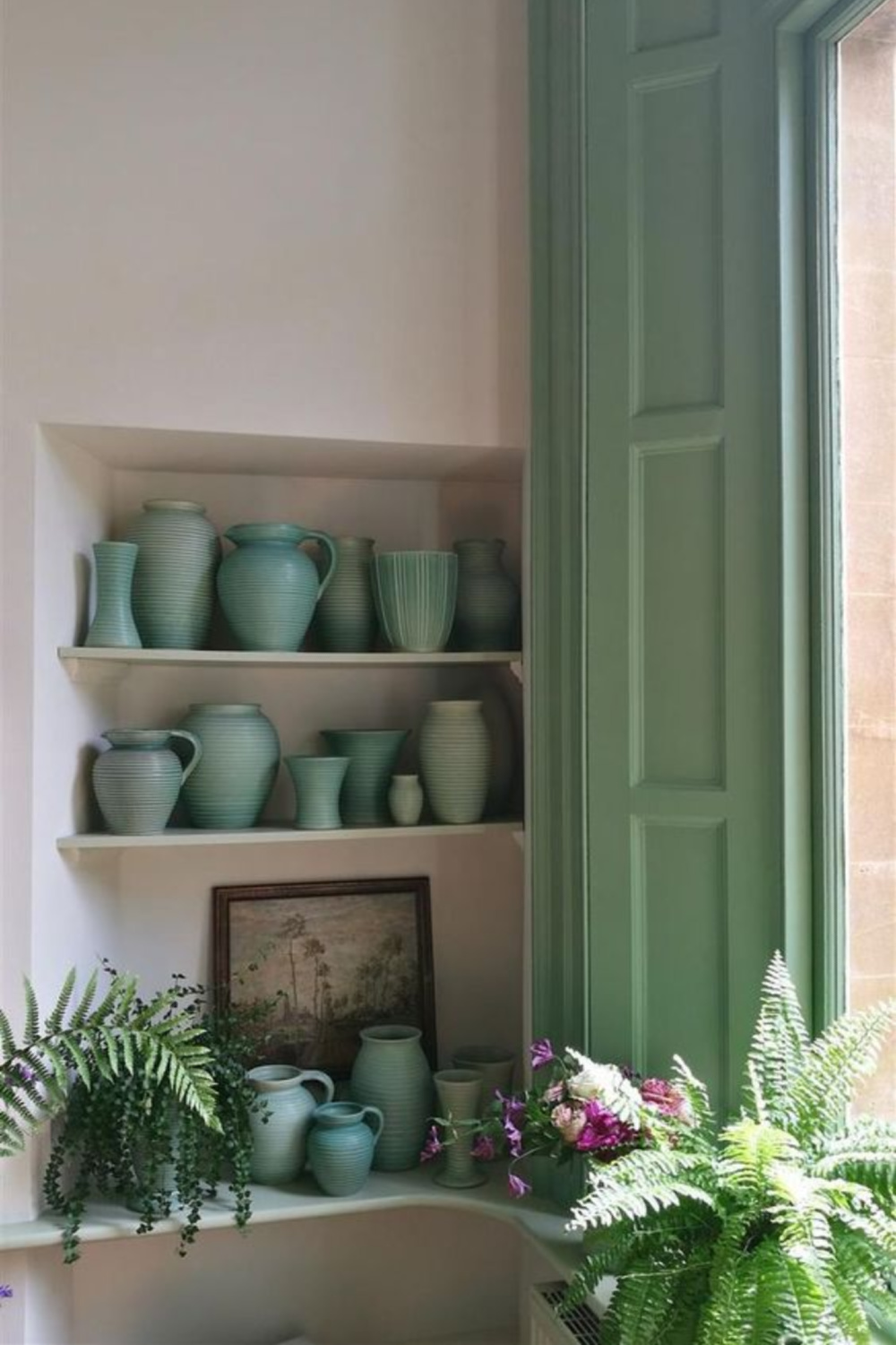 Breakfast Room Green (Farrow & Ball) shutters and light green and jadeite pottery on shelves with ferns. #breakfastroomgreen #greenpaintcolors