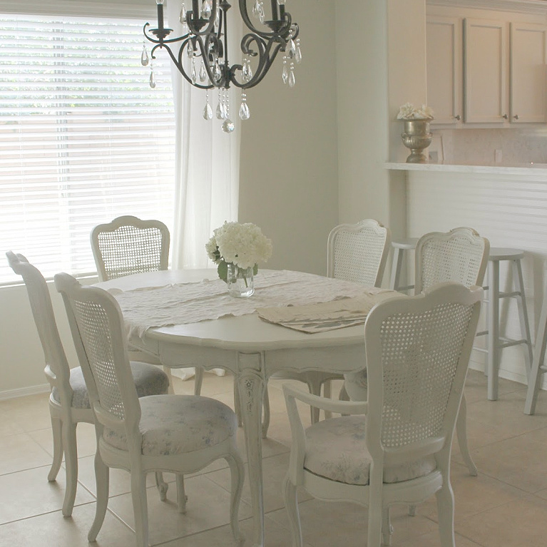 Beautiful serene shabby chic dining room with cane back chairs by Hello Lovely Studio. #diningroom #hellolovelystudio #shabbychic #frenchcountry