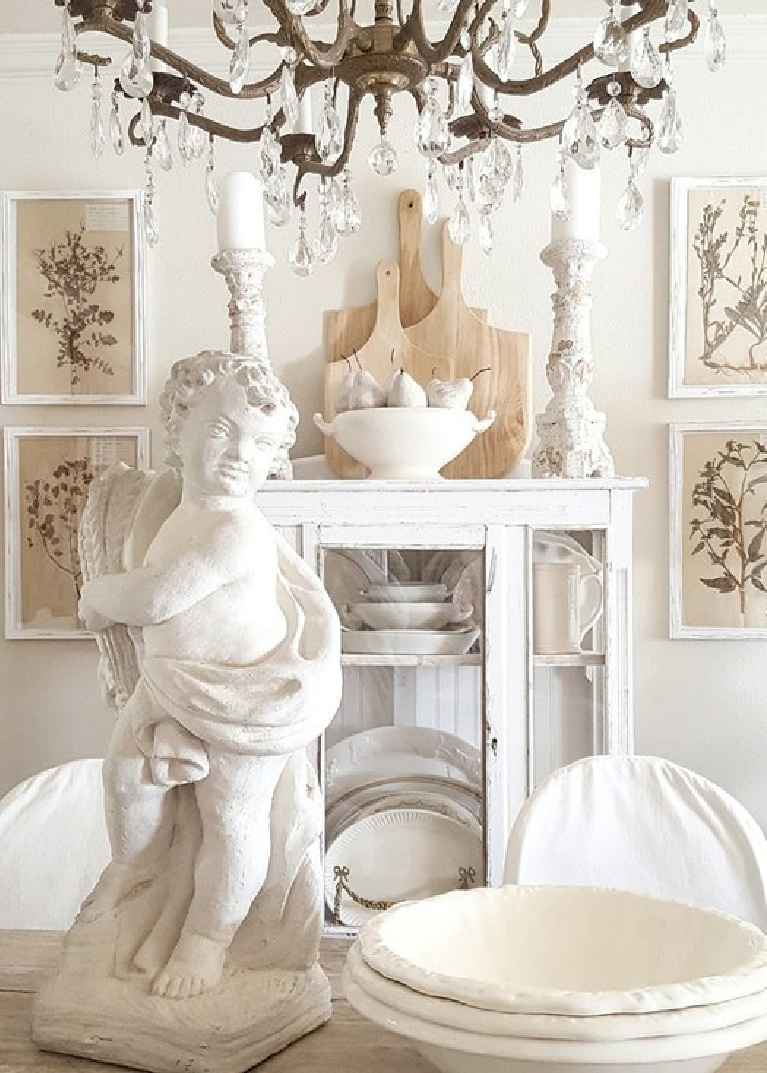 White accents in a French dining room with antiques and herbarium. #thefrenchnestco #frenchcountry #diningrooms