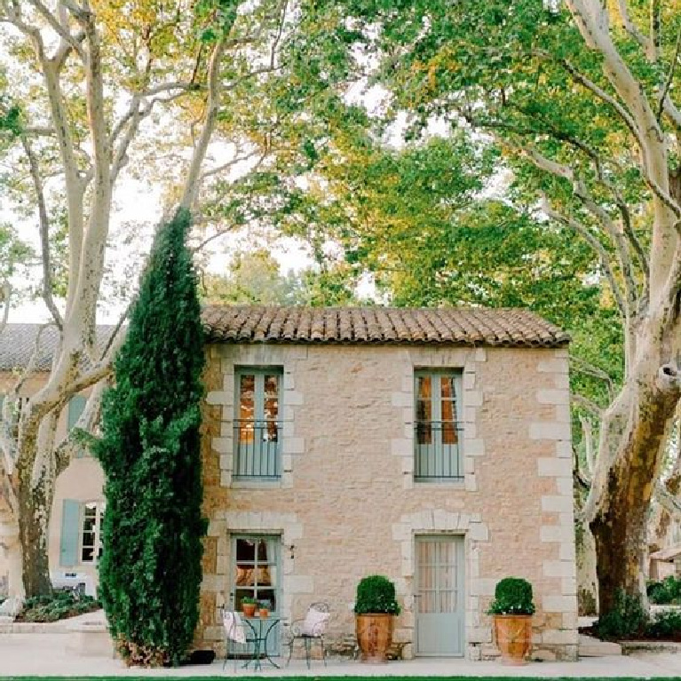 Charming stone guest house with green accents at Provence Poirers in France. #stonecottage #provence #romantichomes #houseexterior #cottageexterior #oldworldstyle