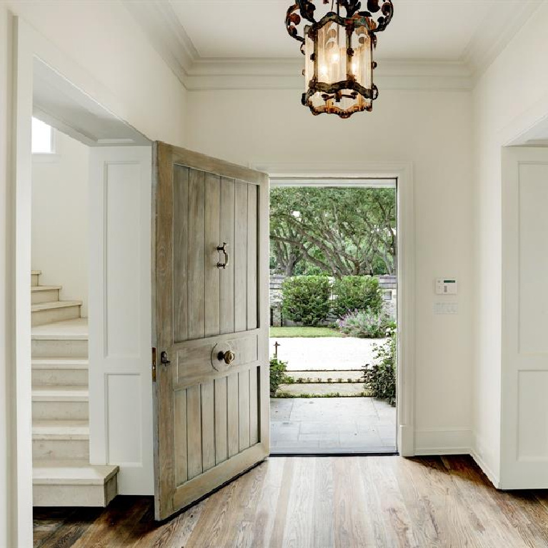 Stunning entry and wood plank front door in breathtaking French inspired Houston Home (2535 Inwood). Come see more old world new builds. #frenchcountry #housedesign #interiordesign #luxuryhome #frenchhome #enry