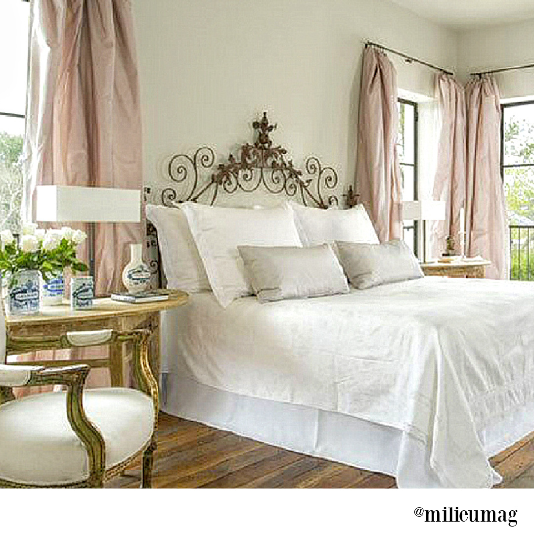 Elegant French country bedroom design by Pamela Pierce with antiques and rustic wood floors. #interiordesign #frenchcountry #pamelapierce #bedroomdecor #oldworld #frenchbedroom