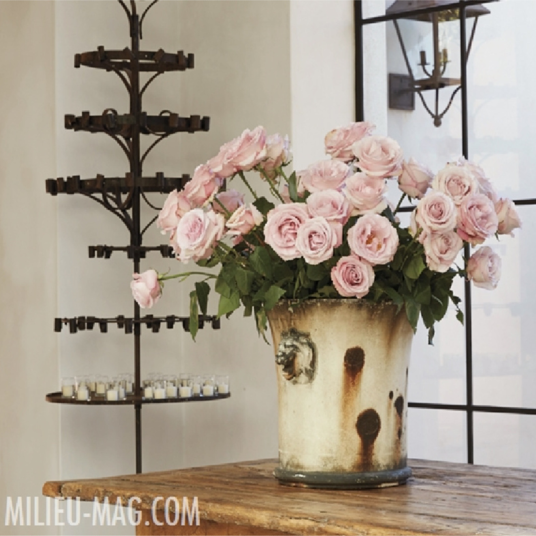 Pink roses and and antiques in a French country home with interior design by Pamela Pierce. #pamelapierce #frenchcountry #interiordesign #milieu #pinkroses #oldworld #antiques
